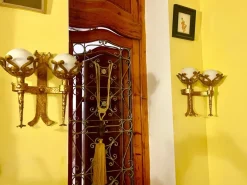 Clearance Pamono Spanish Wall Light in Gilt Iron with Milk Glass Globes, 1950, Set of 2